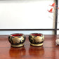 deux mini brasero japonais en laque noire motif fleurs pivoine dorées