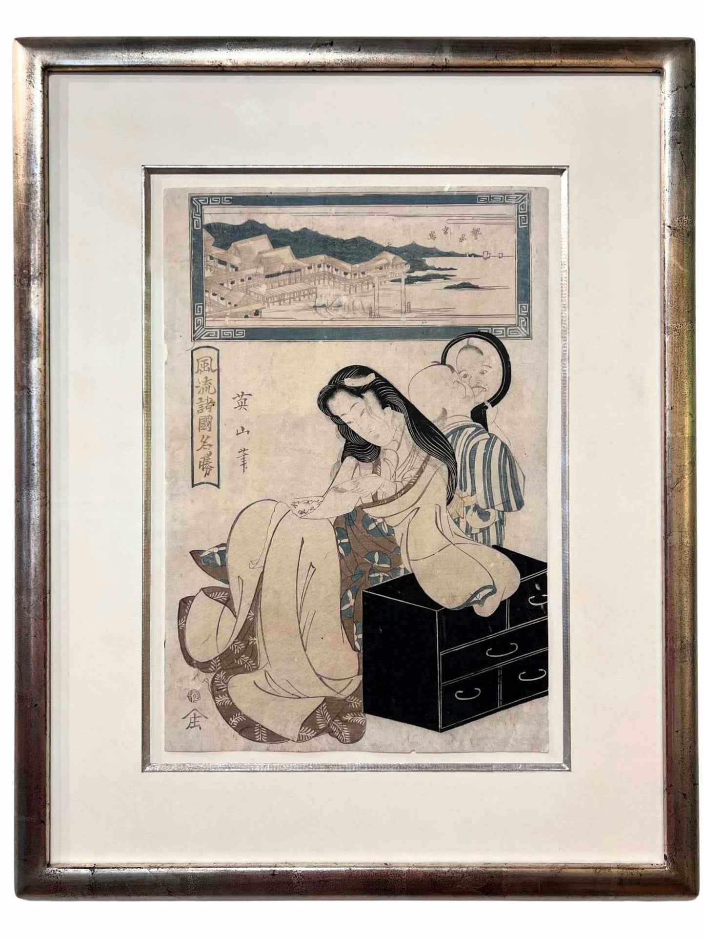 estampe japonaise de Eizan, une femme assise et son enfant faisant des grimaces devant un miroir, avec cadre doré à l'or blanc