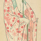 Estampe Japonaise de femme nue enfilant un kimono léger fleuri de printemps, les mains et la poitrine