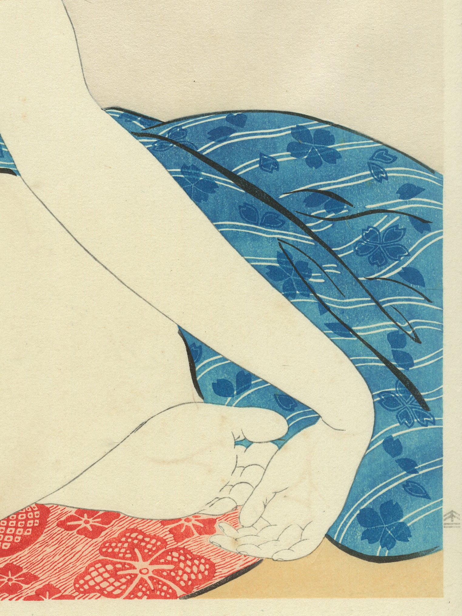 Estampe japonaise détail de l’estampe pied et main sur le coussin rouge