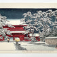 estampe japonaise la neige tombe la nuit sur le temple rouge