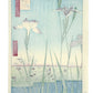 Estampe Japonaise d’Utagawa Hiroshige représentant deux grands iris au premier plan et un vaste jardin fleuri en arrière-plan, le verso de l'estampe