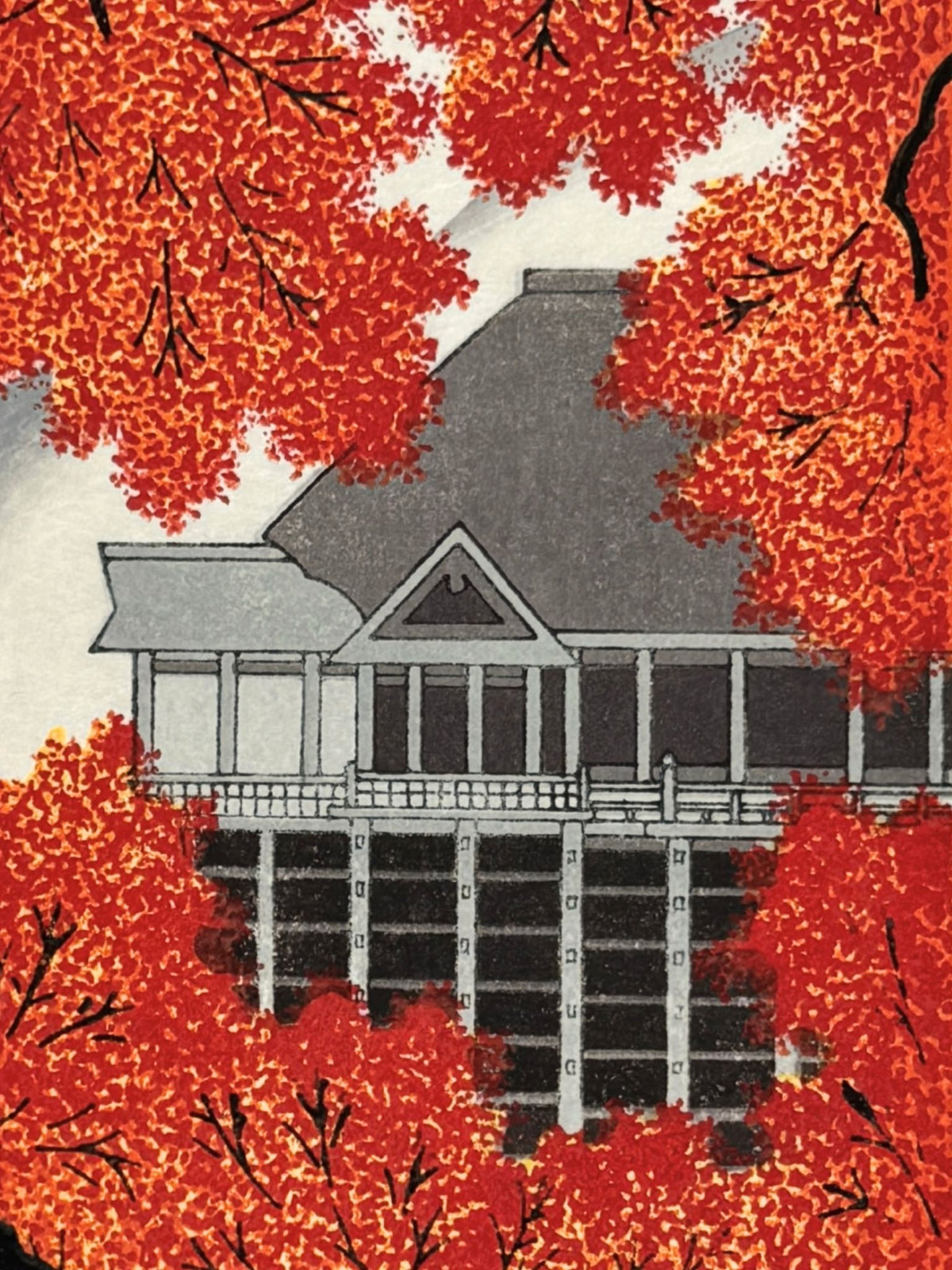 estampe japonaise de Teruhide Kato du temple Kiyomizu apparaissant derrière un rideau d'érables rouge à l'automne, le verso de l'estampe, gros plan sur le temple.