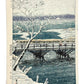 estampe japonaise  de neige de kasamatsu personnage sur un pont en pleine tempête de neige