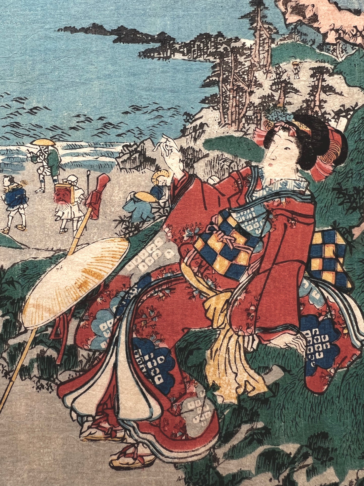 Le voyage de la mariée, une coutisane en kimono rouge assise sur le chemin