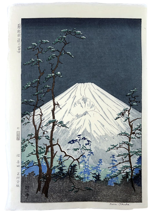 estampe japonaise Mont Fuji blanc dans le gris bleu  sombre de la nuit, arbres tortueux au premier plan