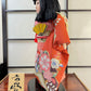 Poupée Japonaise Traditionnelle  Ichimatsu | Jeune fille en kimono orange fleuri profil gauche