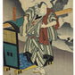 Estampe Japonaise de Sadanobu représentant l'acteur de kabuki Nakamura Shikan II dans le rôle de Danshichi Kurobei, debout devant une chaise à porteur