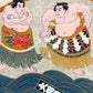 Sérigraphie japonaise de lutteurs de sumo en habits cérémoniels, gros plan sur deux sumos face à face.