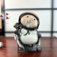Tirelire tanuki en céramique émaillée noire et crème, style japonais traditionnel