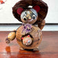 tanuki en bois avec son chapeau, bébé et sa bouteille de saké