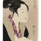 Estampe japonaise de Utamaro, portrait d’une femme tenant une lettre d’amour dans ses mains.