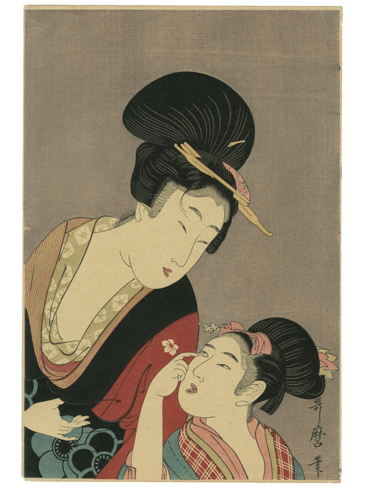 Estampe japonaise d’Utamaro montrant une mère parlant à sa fille qui tire sa paupière en souriant.