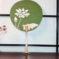 eventail Uchiwa vert avec fleur de lotus découpée, le recto