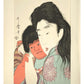 Estampe Japonaise de Utamaro représentant Kintarō, blotti dans les bras de sa mère Yamauba, avec passe-partout