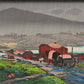 estampe japonaise de paysage, une charette tirée par un cheval avance sur un chemin sous la pluie