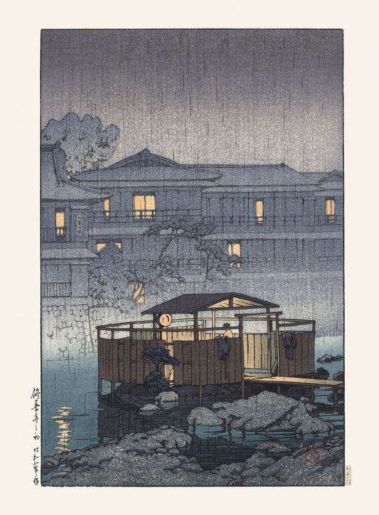 estampe japonaise une personne se baigne dans un onsen en bord de riviere le soir
