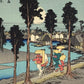 estampe japonaise de Hiroshige, des voyageurs sur la route du Tokaido arrivent au village de Nemazu, sous une nuit de pleine lune. Un voyageur porte un masque de Tengu sur son dos