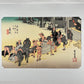 estampe japonaise de Hiroshige, des porteurs posent bagages pour se reposer à la station Fujida du Tokaido, avec le passe-partout d'origine