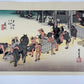 estampe japonaise de Hiroshige, des porteurs posent bagages pour se reposer à la station Fujida du Tokaido