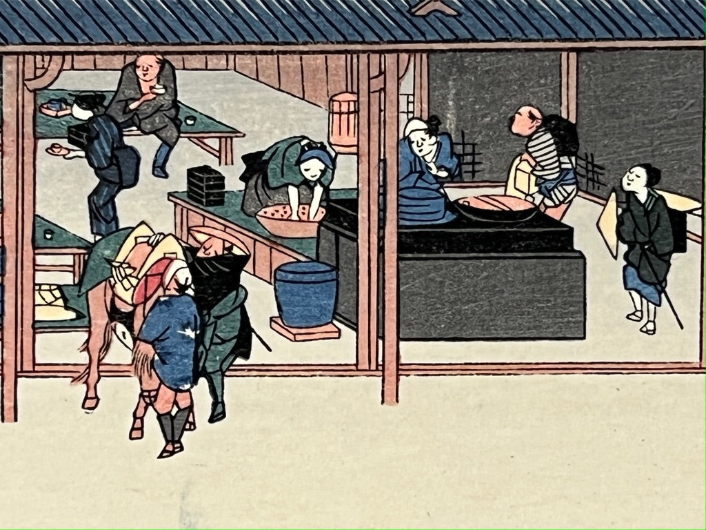 estampe japonaise des porteurs devant une auberge sur la route du Tokaido
