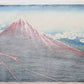 estampe japonaise Hokusai le Mont Fuji sous l'orage, des éclairs zèbrent son flan, dos de l'estampe
