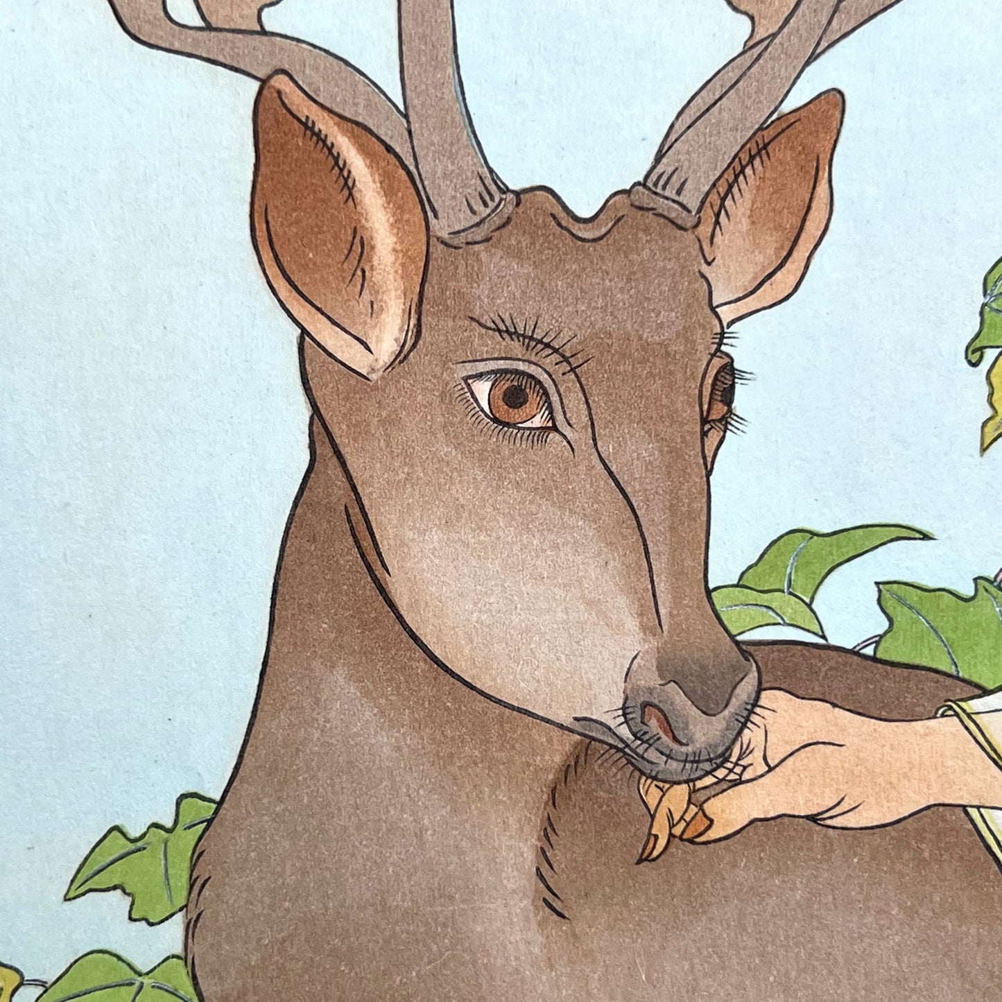 estampe japonaise un homme chinois et un cerf, gros plan sur la tête du cerf