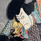 estampe japonaise originale de Kunisada représentant deus samouraïs dans une pièce de théâtre kabuki, tête avec dragon