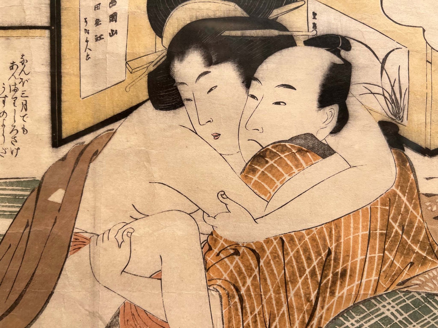 estampe japonaise érotique, un couple faisant l'amour, les visages du couple enlacés