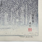 estampe japonaise deux grues du Japon dansent face à face sous la neige, la signature et le sceau de l'artiste